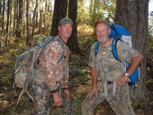 Jerry and Mark's father, Steve, loaded down with elk meat